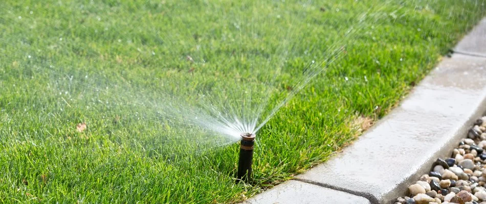 Irrigation system spraying water on lawn in Hypoluxo, FL.