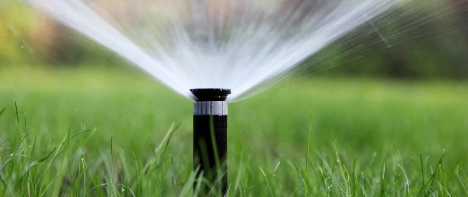 Sprinkler system hydrating lawn in West Palm Beach, FL.